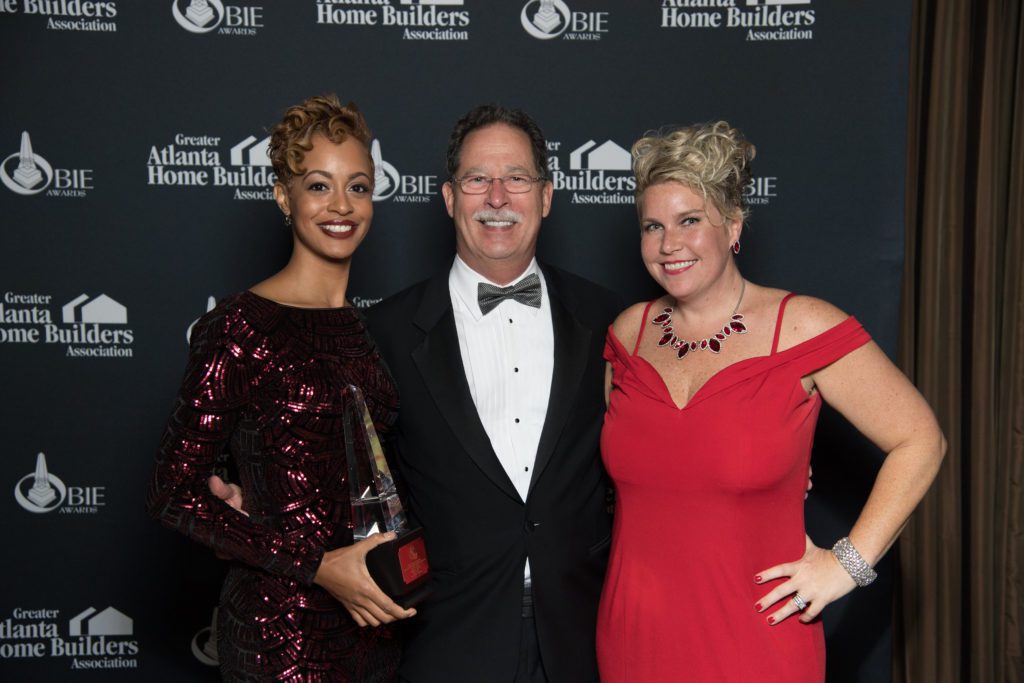 Olivia Westbrooks, SteveBrock, and Ansley Brooks pose with OBIE award